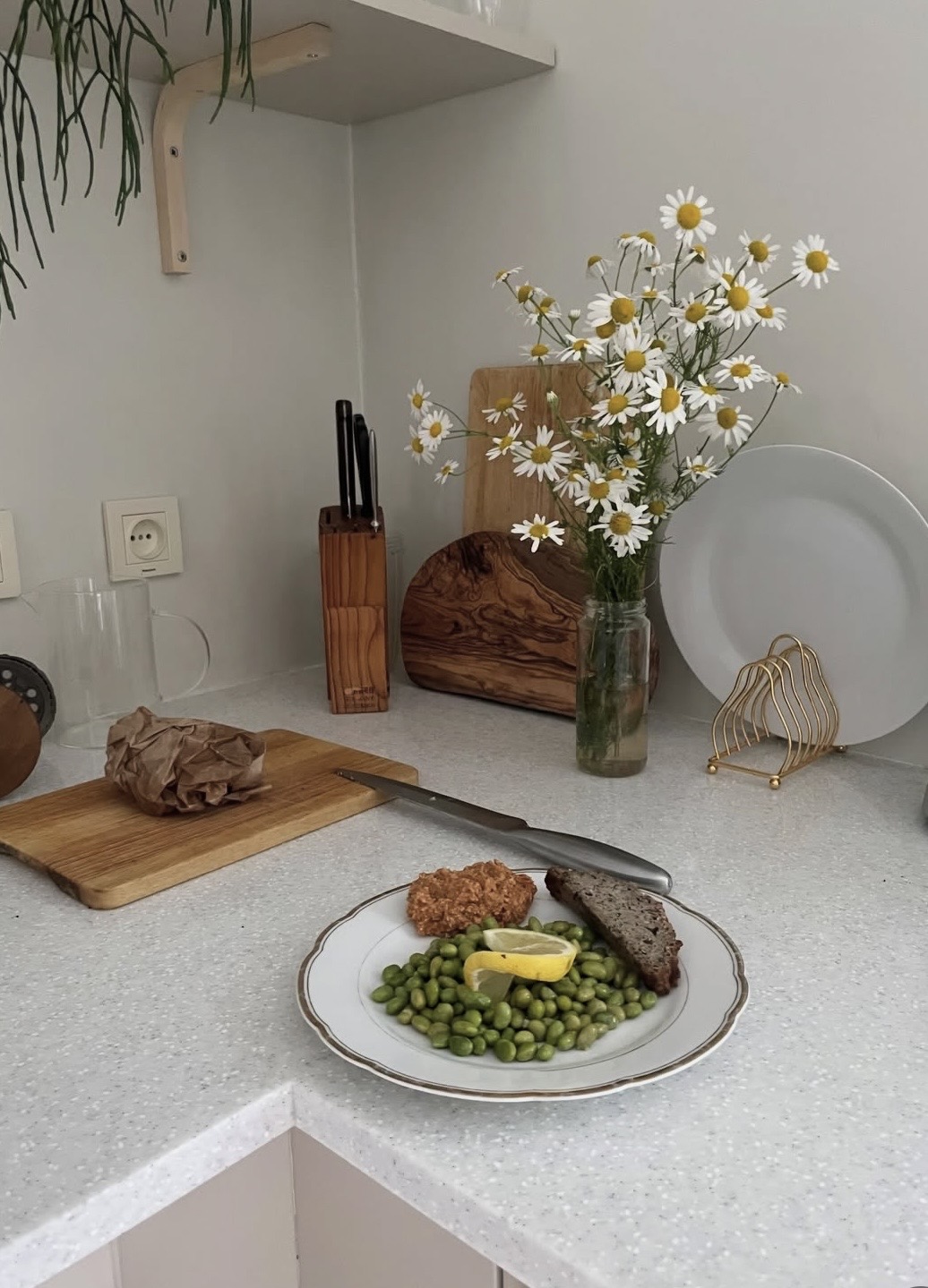 savory plant-based breakfast with buckwheat-flax bread, edamame, roasted courgette, and pumpkin-tomato spread